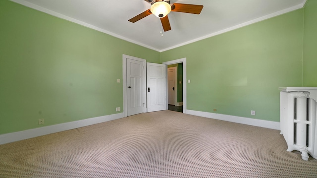 110 E Center St, Mount Morris, IL 61054 - unfurnished bedroom with radiator heating unit, carpet floors, ornamental molding, baseboards, and ceiling fan