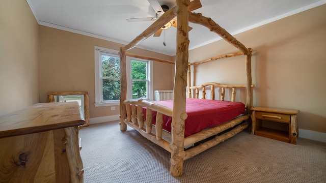 110 E Center St, Mount Morris, IL 61054 - carpeted bedroom featuring crown molding, baseboards, ceiling fan, and radiator heating unit