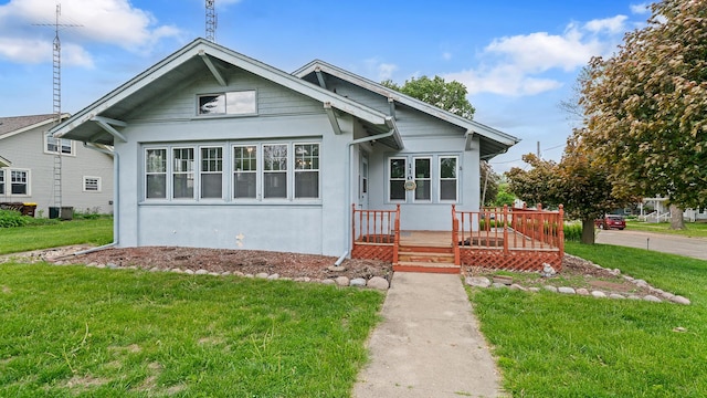 110 E Center St, Mount Morris, IL 61054 - bungalow-style home featuring a front lawn and stucco siding