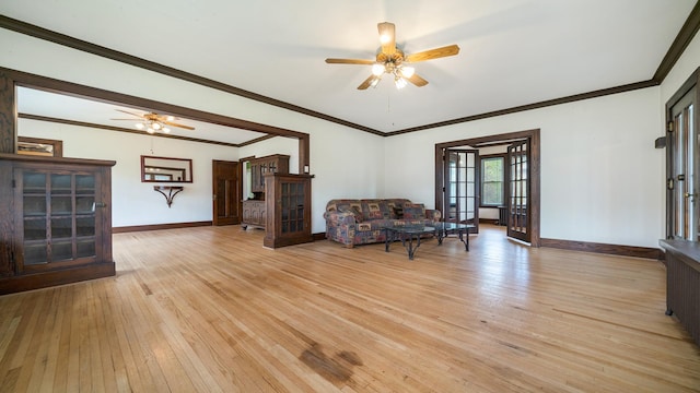 110 E Center St, Mount Morris, IL 61054 - living room featuring a ceiling fan, light wood-style floors, baseboards, and crown molding