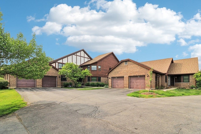 35 Terrace Ln Unit C, Lake Zurich, IL 60047 - english style home with brick siding, an attached garage, and asphalt driveway