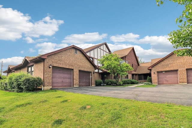35 Terrace Ln Unit C, Lake Zurich, IL 60047 - english style home featuring brick siding, an attached garage, a front yard, and driveway