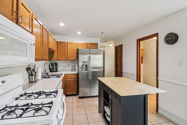 35 Terrace Ln Unit C, Lake Zurich, IL 60047 - kitchen with white appliances, a sink, backsplash, recessed lighting, and light tile patterned floors