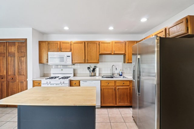 35 Terrace Ln Unit C, Lake Zurich, IL 60047 - kitchen with white appliances, a sink, light tile patterned floors, light countertops, and recessed lighting