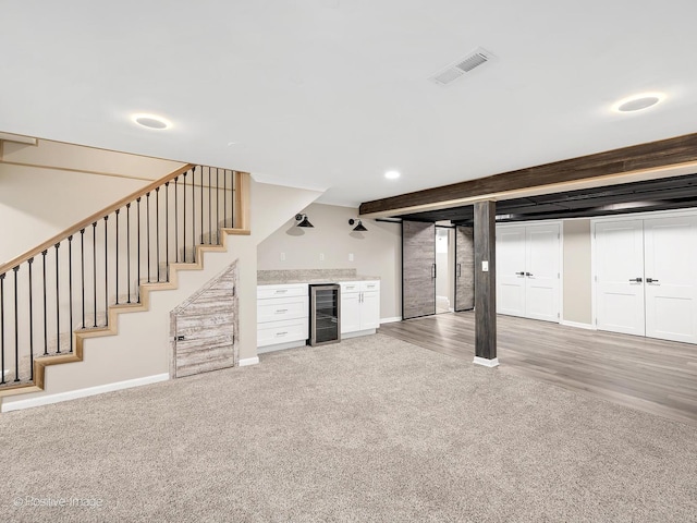 9 Charleston Rd, Hinsdale, IL 60521 - finished below grade area with wine cooler, a bar, light carpet, stairs, and baseboards
