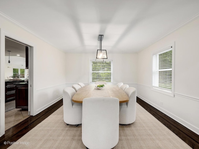 9 Charleston Rd, Hinsdale, IL 60521 - dining space with dark wood-style floors, healthy amount of natural light, ornamental molding, and baseboards