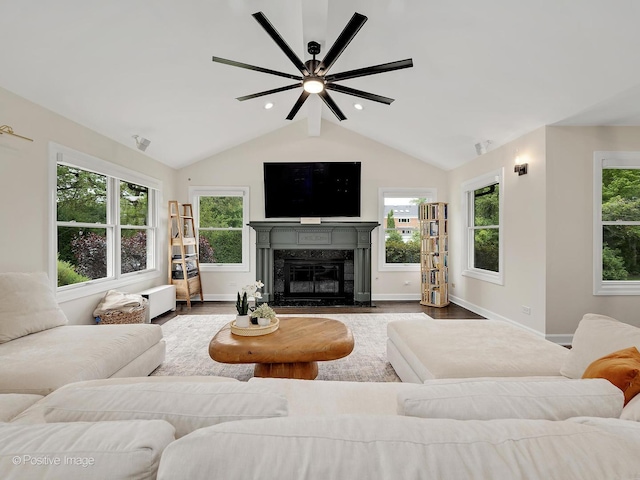 9 Charleston Rd, Hinsdale, IL 60521 - living room featuring wood finished floors, plenty of natural light, vaulted ceiling, ceiling fan, and a fireplace with flush hearth