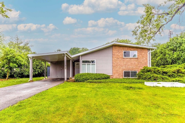826 Midway Rd, Northbrook, IL 60062 - view of front of home with a front yard, brick siding, a carport, driveway, and central AC