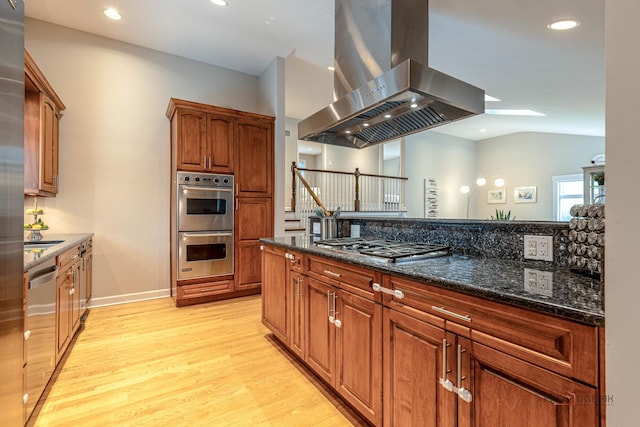 826 Midway Rd, Northbrook, IL 60062 - kitchen featuring ventilation hood, appliances with stainless steel finishes, light wood finished floors, dark stone counters, and recessed lighting