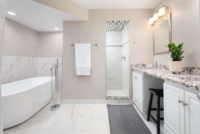 1580 Aberdeen Ct Unit 1580, Naperville, IL 60564 - bathroom with a soaking tub, double vanity, marble look tiles, tiled shower, and recessed lighting