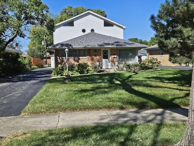 928 S Hillcrest Ave, Elmhurst, IL 60126 - view of front of house featuring brick siding, roof with shingles, and asphalt driveway