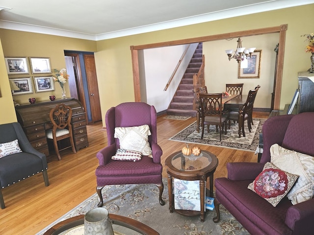 928 S Hillcrest Ave, Elmhurst, IL 60126 - living area featuring a chandelier, stairway, wood finished floors, and ornamental molding