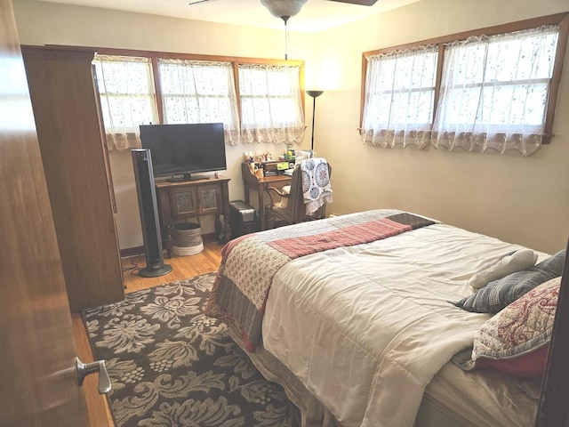 928 S Hillcrest Ave, Elmhurst, IL 60126 - bedroom featuring multiple windows and wood finished floors