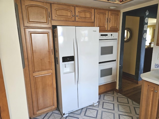 928 S Hillcrest Ave, Elmhurst, IL 60126 - kitchen with white appliances, brown cabinets, and light countertops