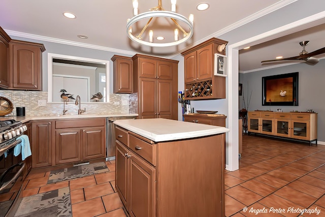41653 N Lotus Ave, Antioch, IL 60002 - kitchen with appliances with stainless steel finishes, decorative backsplash, a center island, light countertops, and light tile patterned floors