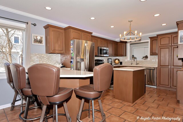 41653 N Lotus Ave, Antioch, IL 60002 - kitchen with stainless steel appliances, a chandelier, backsplash, light countertops, and recessed lighting
