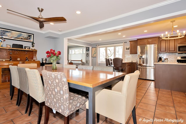 41653 N Lotus Ave, Antioch, IL 60002 - dining room with a chandelier, ornamental molding, a ceiling fan, light tile patterned floors, and recessed lighting