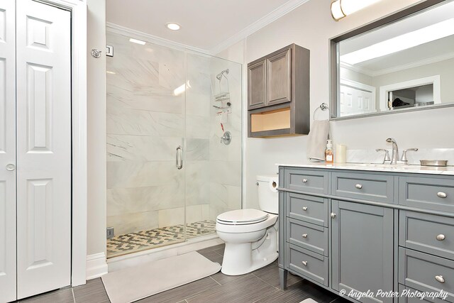 41653 N Lotus Ave, Antioch, IL 60002 - bathroom with a shower stall, vanity, crown molding, a closet, and recessed lighting