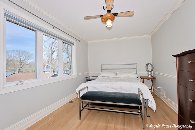 41653 N Lotus Ave, Antioch, IL 60002 - bedroom featuring wood finished floors, ornamental molding, and ceiling fan