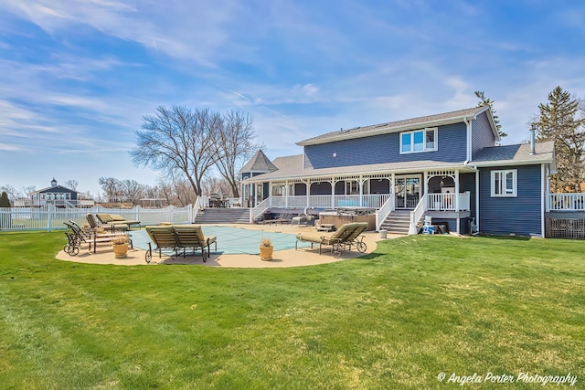 41653 N Lotus Ave, Antioch, IL 60002 - rear view of house featuring stairs, a patio area, and an outdoor hangout area