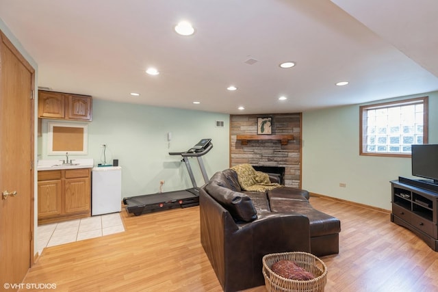 1014 Douglas Ave, Flossmoor, IL 60422 - living area with light wood-type flooring, a fireplace, recessed lighting, and baseboards