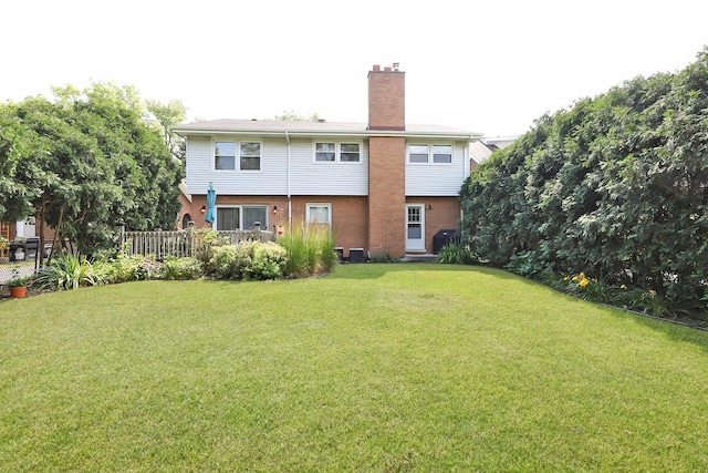 1014 Douglas Ave, Flossmoor, IL 60422 - rear view of house with brick siding, a chimney, and a lawn