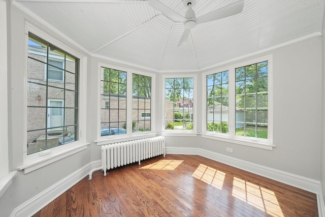 734 Forest Rd, La Grange Park, IL 60526 - unfurnished sunroom featuring radiator heating unit, baseboards, wood finished floors, ornamental molding, and vaulted ceiling