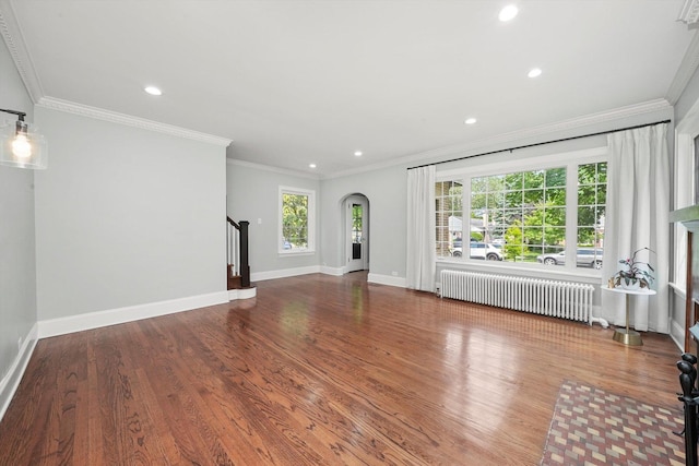 734 Forest Rd, La Grange Park, IL 60526 - unfurnished living room with radiator, stairs, plenty of natural light, arched walkways, and recessed lighting