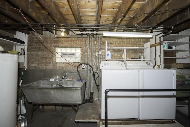 4033 N Austin Ave, Chicago, IL 60634 - unfinished below grade area featuring independent washer and dryer, a sink, brick wall, and water heater