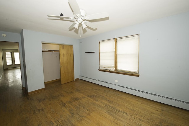 4033 N Austin Ave, Chicago, IL 60634 - unfurnished bedroom with a baseboard heating unit, dark wood-style floors, a closet, baseboards, and a ceiling fan