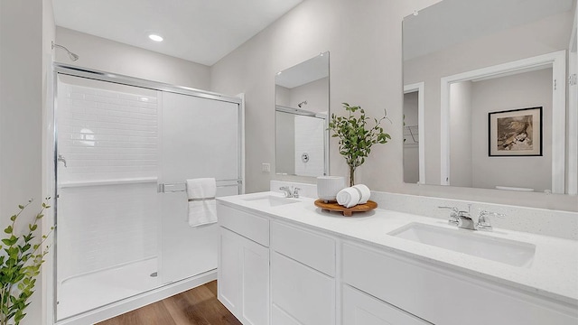 13603 S Carmel Blvd, Plainfield, IL 60544 - full bathroom featuring a stall shower, double vanity, toilet, and wood finished floors