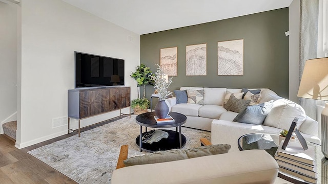 13603 S Carmel Blvd, Plainfield, IL 60544 - living area with wood finished floors, baseboards, and stairway