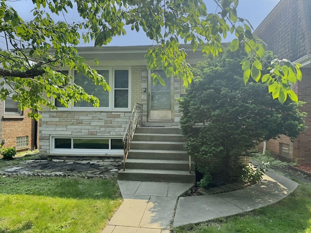 5349 N Meade Ave, Chicago, IL 60630 - doorway to property featuring brick siding and a lawn