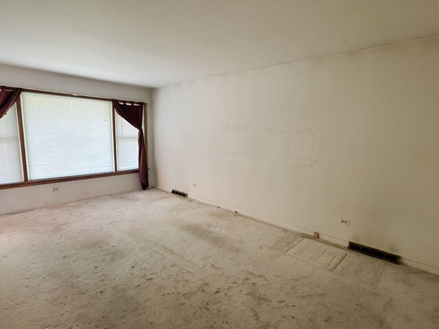 5349 N Meade Ave, Chicago, IL 60630 - spare room with light colored carpet and baseboards