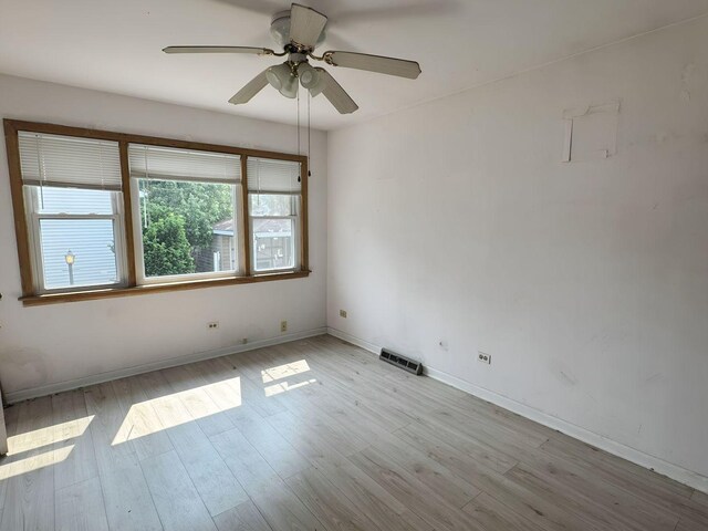 5349 N Meade Ave, Chicago, IL 60630 - spare room featuring light wood finished floors, baseboards, and ceiling fan