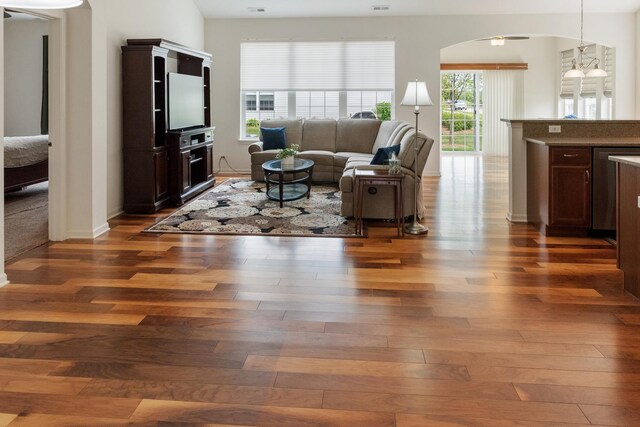 552 Autumn Cir, Pingree Grove, IL 60140 - living area with hardwood / wood-style floors, arched walkways, and baseboards
