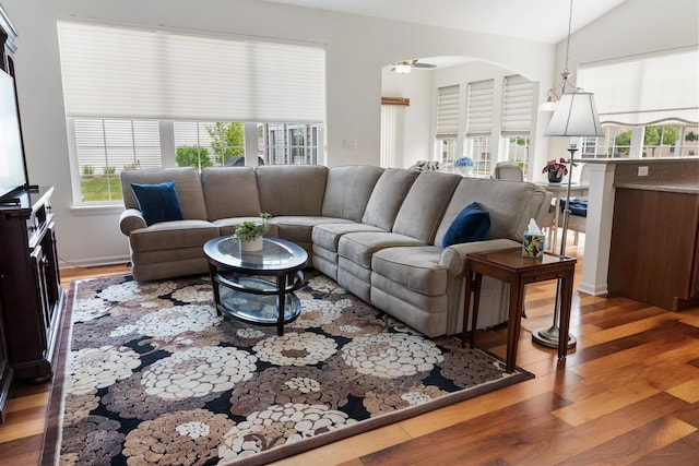 552 Autumn Cir, Pingree Grove, IL 60140 - living room featuring light wood-type flooring, a ceiling fan, vaulted ceiling, and arched walkways