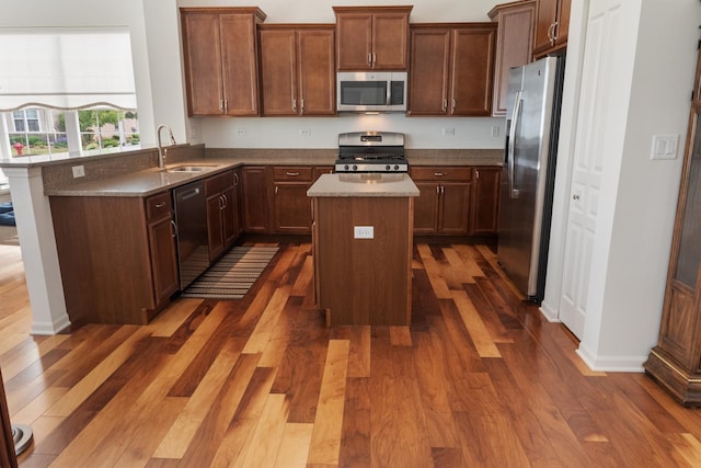 552 Autumn Cir, Pingree Grove, IL 60140 - kitchen with stainless steel appliances, a center island, dark wood-style flooring, and a sink