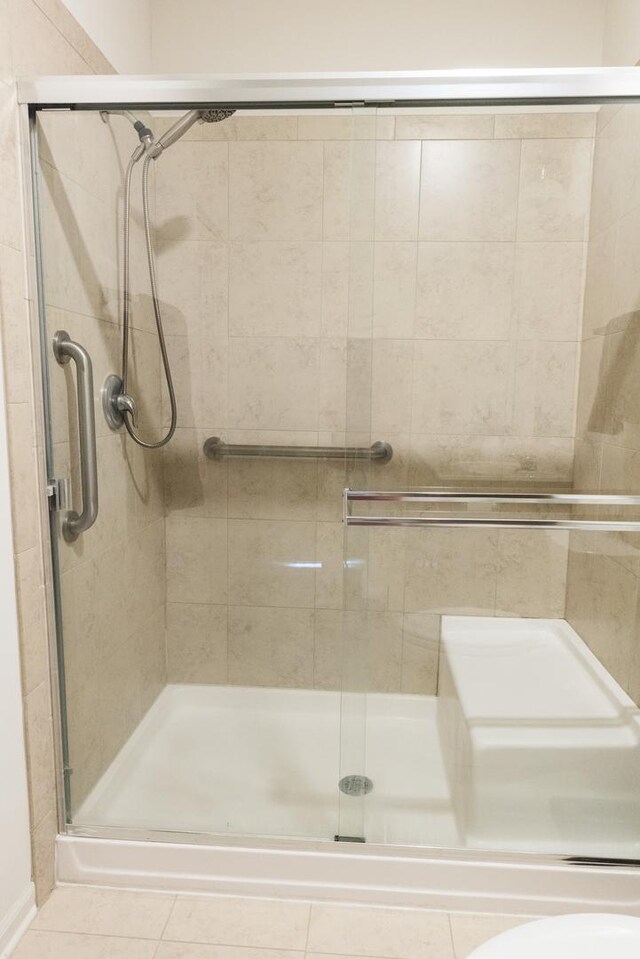 552 Autumn Cir, Pingree Grove, IL 60140 - full bathroom featuring a stall shower and tile patterned floors