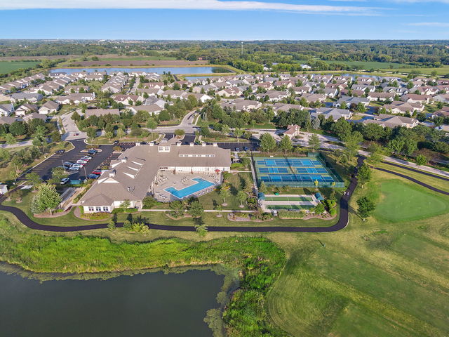 552 Autumn Cir, Pingree Grove, IL 60140 - aerial view of property and surrounding area with a large body of water and nearby suburban area