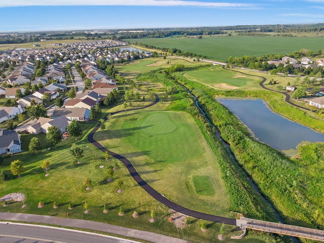 552 Autumn Cir, Pingree Grove, IL 60140 - aerial view of property's location with a large body of water, nearby suburban area, and a golf course