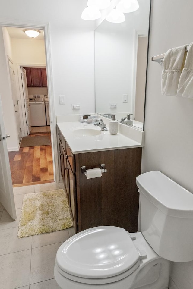 552 Autumn Cir, Pingree Grove, IL 60140 - half bath featuring vanity, tile patterned floors, toilet, and washer and dryer