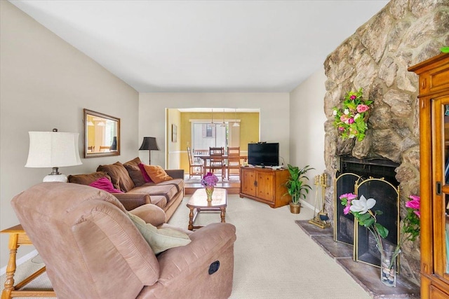 642 Dunham Rd, Gurnee, IL 60031 - living area with light carpet, a stone fireplace, and baseboards