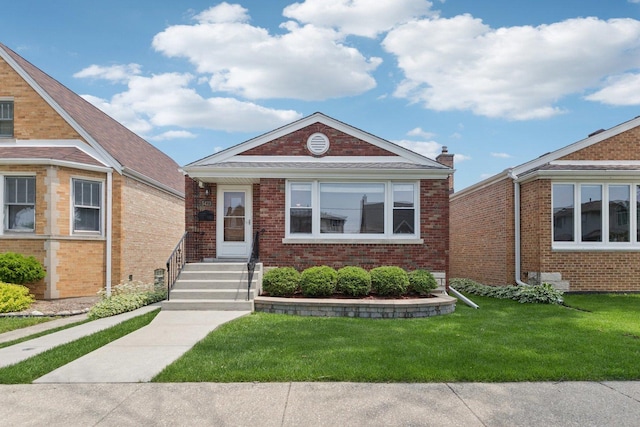 5423 S Rutherford Ave, Chicago, IL 60638 - view of front of house featuring a front yard and brick siding