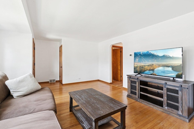 5423 S Rutherford Ave, Chicago, IL 60638 - living area featuring arched walkways and wood finished floors