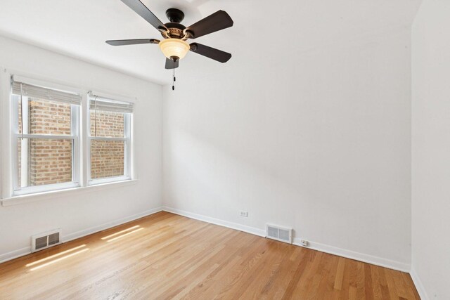5423 S Rutherford Ave, Chicago, IL 60638 - empty room featuring light wood finished floors and a ceiling fan