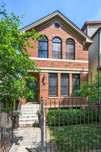 3329 N Bell Ave, Chicago, IL 60618 - view of front of home with brick siding and a fenced front yard