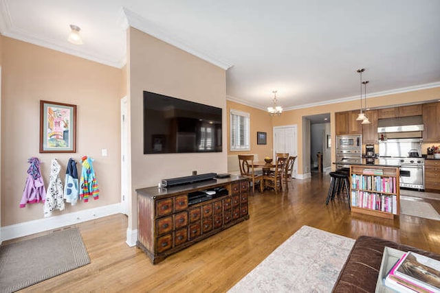 3329 N Bell Ave, Chicago, IL 60618 - living room with a chandelier, crown molding, and light wood-style flooring