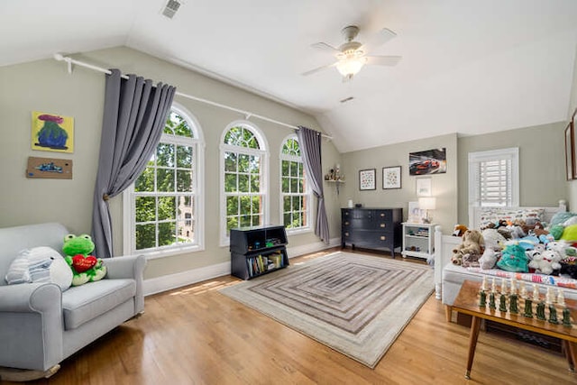 3329 N Bell Ave, Chicago, IL 60618 - living area featuring lofted ceiling, a ceiling fan, healthy amount of natural light, and wood finished floors