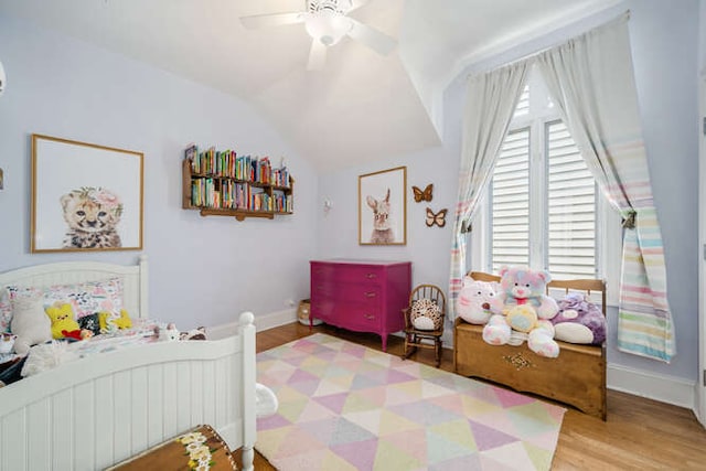 3329 N Bell Ave, Chicago, IL 60618 - bedroom featuring wood finished floors, vaulted ceiling, and ceiling fan
